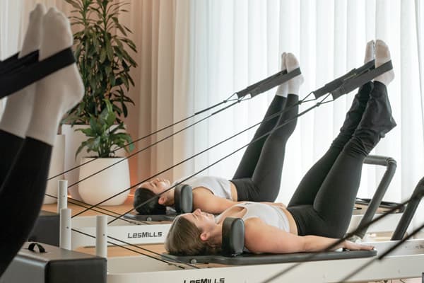 eos fitness members using pilates reformer machines