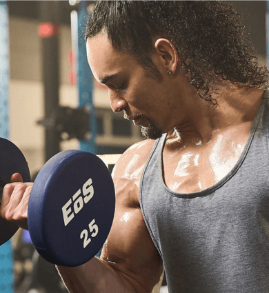 eos fitness member performing bicep curls at the gym