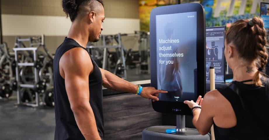 eos member being shown how to use smart strength equipment