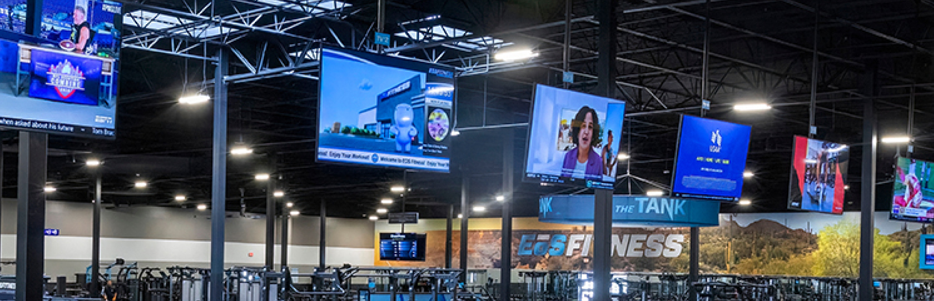 a row of ads on gym tvs