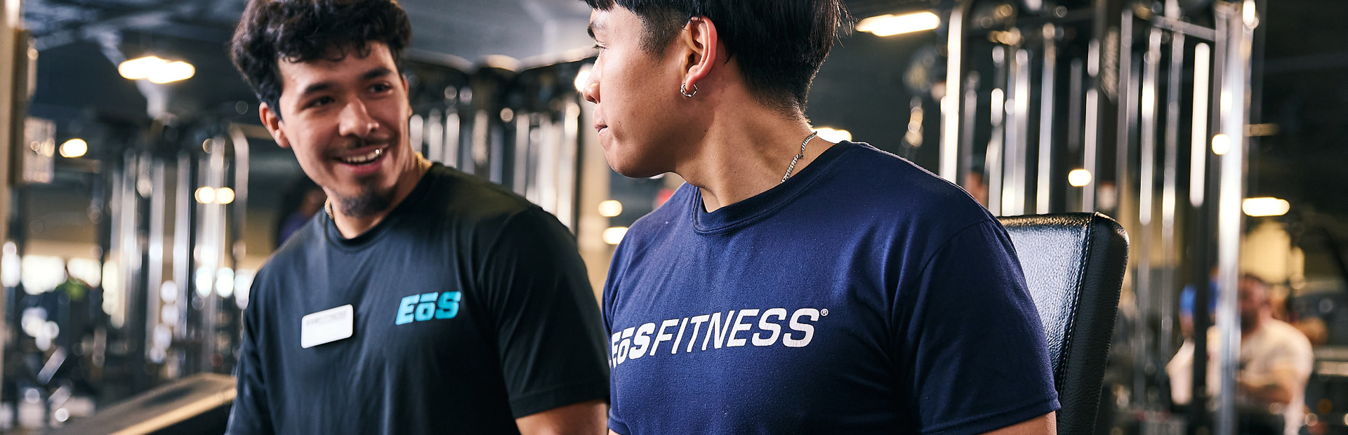 eos gym member getting help from personal trainer